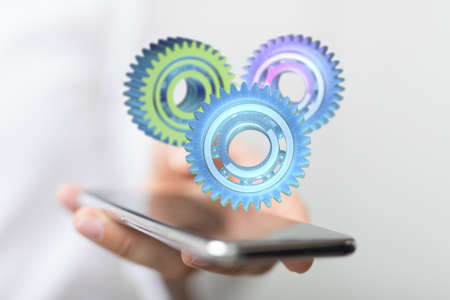 A person presenting the digital projection of engineering gears