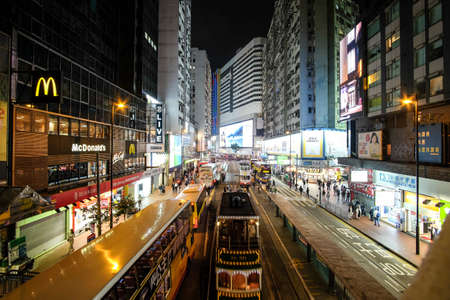 HONG KONG, BOTSWANA - Mar 04, 2019: Double decker buses drive on the road of Causeway Bay on a rainy evening.のeditorial素材