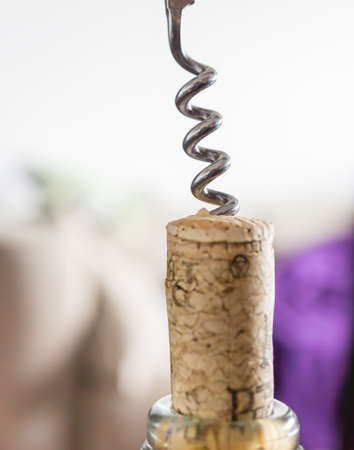 a closeup shot of a corkscrew on a corkの写真素材