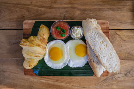 A high angle shot of different kinds of food put on a wooden surfaceの写真素材