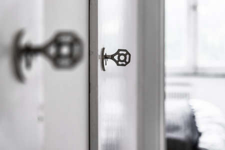 Detail of vintage door with key in key hole.の写真素材