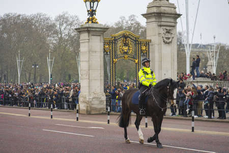 LONDON, UNITED KINGDOM - Apr 13, 2019: A scenery of people entering the famous historic Buckingham...