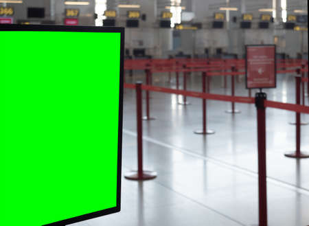 A closeup shot of a display board with a green space for your image in an airport