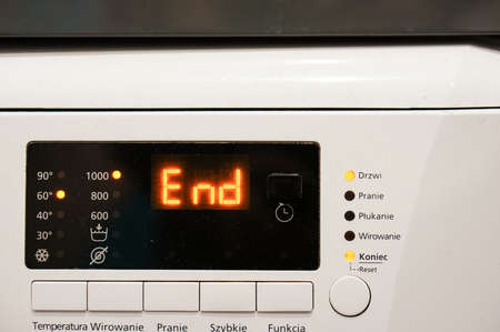Close up of a laundry machine showing the end of the program.の写真素材