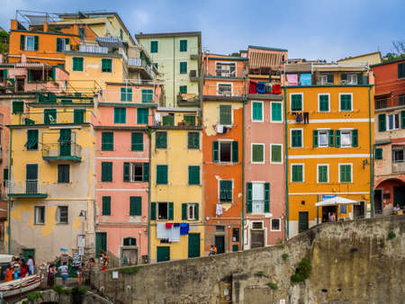 RIOMAGGIORE, ITALY - Jul 07, 2019: Riomaggiore - the village of Cinque Terre National Park on the Coast of Italy. Beautiful colors at sunset. Province of La Spezia, Liguriaのeditorial素材