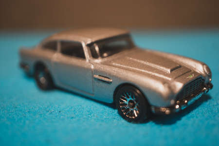 POZNAN, POLAND - Feb 03, 2020: Grey Mattel Hot Wheels Aston Martin toy model car in narrow depth of field.のeditorial素材