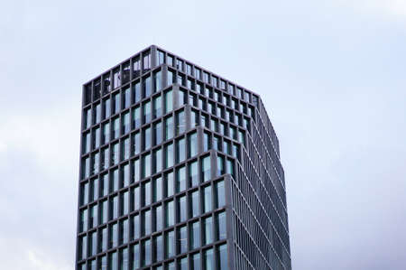 POZNAN, POLAND - Feb 04, 2020: Top of the modern Baltyk office building on a cloudy day. Horizontal low angle view.のeditorial素材