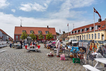 AAKIRKEBY, DENMARK - Jun 27, 2019: Aakirkeby, Bornholm island, Denmark - 27 June 2019. Local people trading goods in city market of Aakirkeby, Bornholm island, Denmarkのeditorial素材