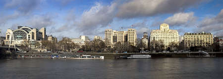 LONDON, UNITED KINGDOM - Mar 02, 2014: Panoramic view of the the Embankment including Embankment Station and Cleopatra's Needleのeditorial素材