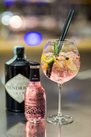 ALBA, ITALY - Apr 25, 2018: the image of a coctail glass with ice ready to drink on a blurred background of a barのeditorial素材