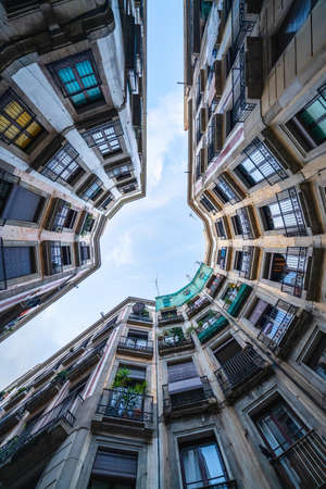 BARCELONA, SPAIN - Nov 16, 2019: Look up of a buildings of the Gothic Quarter, Barcelona, Spain. A very touristic spotのeditorial素材