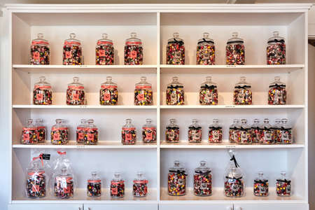 SVANEKE, DENMARK - Jun 28, 2019: Svaneke, Bornholm island, Denmark - June 28, 2019. Bolcheriet - hard candies displayed in jars in famous hard candy manufacture and store in Svaneke.のeditorial素材