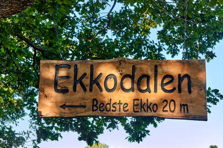 AAKIRKEBY, DENMARK - Jun 27, 2019: Ekkodalen (Echo Valley), Denmark June 27, 2019. Directional sign to Echo Valley - Best echo 20 m, vicinity of Aakirkeby, Bornholm island,のeditorial素材