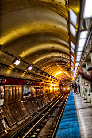 A vertical shot of a train arriving in the metro stationのeditorial素材