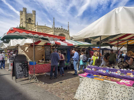 C, UNITED KINGDOM - Aug 11, 2017: CAMBRIDGE, UK:  The Historic Market in Market Square with  Great St Mary's Church in the backgroundのeditorial素材