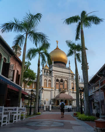 SINGAPORE, SINGAPORE - Jul 28, 2019: man walking early morning near the Masjid Sultan Mosque located at Muscat Street and North Bridge Roadsのeditorial素材