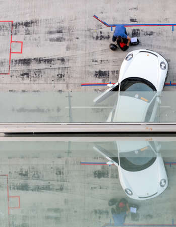 January 25, 2019 - Abu Dhabi, UAE: High angle shot of White Porsche car parked at Yas Marina...