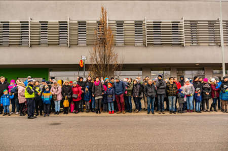 POZNAN, POLAND - Nov 24, 2019: People waiting for a bus during the MPK Katarzynki event.のeditorial素材