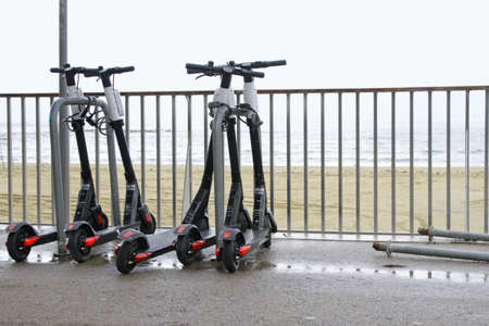 BARCELONA, SPAIN - Sep 09, 2019: 09 September 2019 - Barcelona, Spain: Four e-scooters parked near...