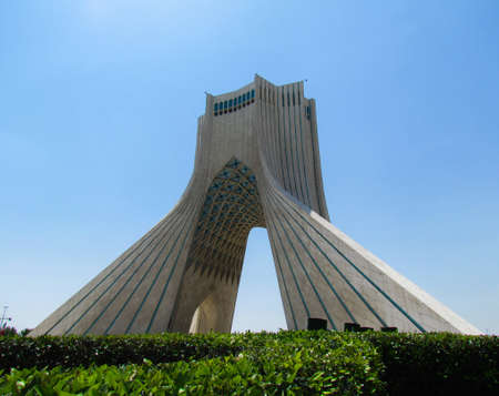 A beautiful view of Azadi tower under the blue sky captured in Tehran, Iranのeditorial素材