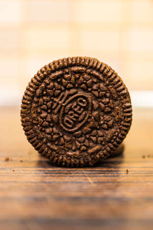POZNAN, POLAND - Feb 06, 2019: Crunchy Oero cookie on a wooden table in soft focus background.のeditorial素材