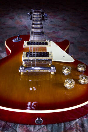 An overhead shot of a shiny gibson guitar