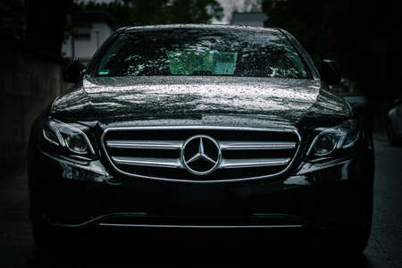 NUREMBERG, GERMANY - May 13, 2019: Front view of luxury mercedes E class, toned down moody after...