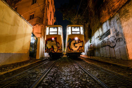 LISBOA, PORTUGAL - Sep 10, 2014: Elevador da Gloria, at night standing side by sideのeditorial素材