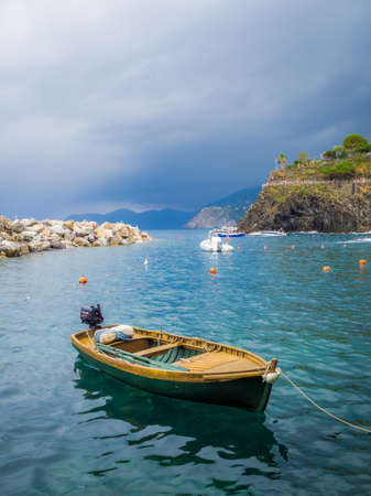 MANAROLA, ITALY - Jul 07, 2019: Boats docked at the cove of Manarola, Cinque Terre, Italy