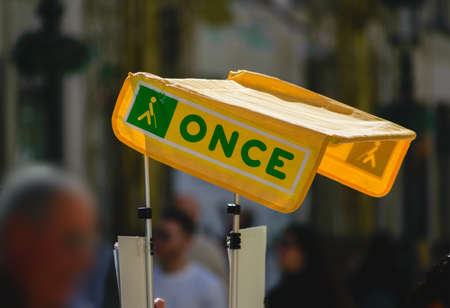 MALAGA, SPAIN - Feb 02, 2020: Malaga / Spain - 12-03-2018 : name and logo of the Spanish foundation named ONCE which is selling lottery tickets. The money is used to help handicappのeditorial素材