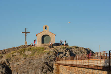 COLLIUORE, FRANCE - Jun 30, 2020: Colioure, France - July 21, 2020: Tourists near chapel of Saint Vincent in sea of Collioure in south of France.のeditorial素材