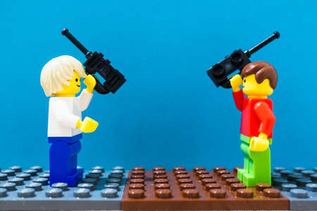 POZNAN, POLAND - Feb 06, 2019: Lego figures concept on blue background.のeditorial素材