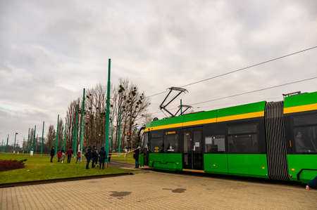 POZNAN, POLAND - Nov 24, 2019: Green exposition public transport tram during the Katarzynki event.のeditorial素材