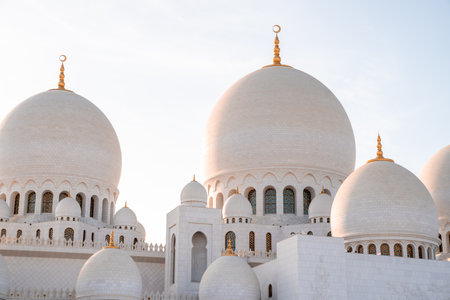 The beautiful view of historical Sheikh Zayed Grand Mosque in Abu Dhabi, UAE during sunsetのeditorial素材