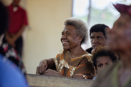 PORT MORESBY, PAPUA NEW GUINEA - Nov 01, 2019: Woman sitting in a church in papua new guinea.