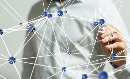 A closeup shot of a person presenting the virtual projection of a digital network