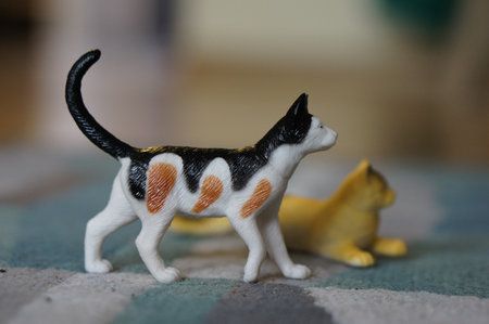 A closeup shot of toys of cats next to each otherの写真素材