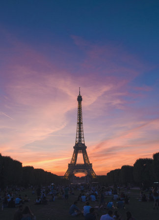 A silhouette of an Eiffel Tower in Paris, France with beautiful scenery of sunset in the background