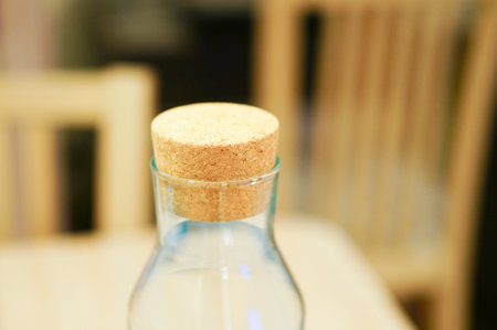 A selective focus shot of a cork stopper in the mouth of a glass bottleの写真素材