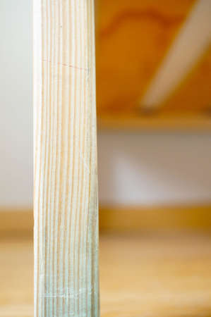 A vertical selective focus shot of a wooden stick