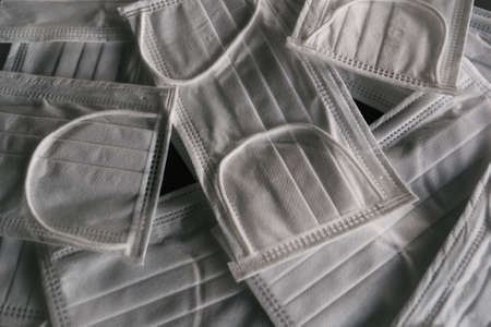 A closeup shot of white face masks - coronavirusの写真素材