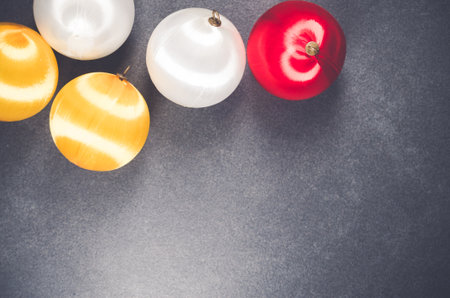 The glowing yellow-white-red Christmas balls decoration - copy space