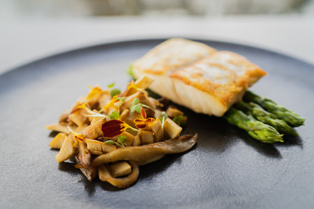 A selective focus shot of tur meat with asparagus and tasty sauceの写真素材