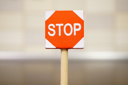 A soft focus shot of a stop sign on the roadの写真素材