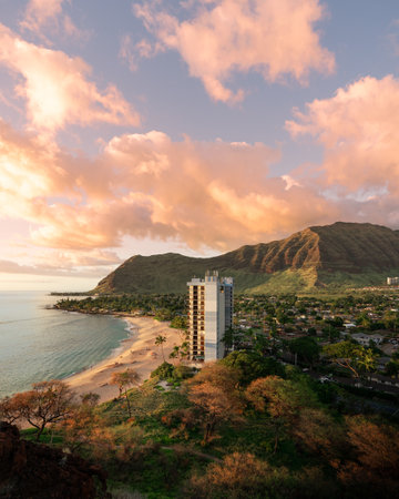 A vertical shot of an apartment on the beach shore under a beautiful sky - great for a backgroundの写真素材