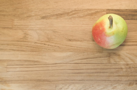 A top view of a pear on a wooden surfaceの写真素材