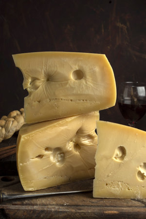 A vertical shot of blocks of delicious swiss cheese