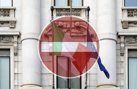 Italy in lock-down and travel bans: Italian national flag and EU flagの写真素材
