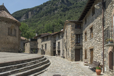 Stone ruined buildings of an old town surrounded by mountainsの写真素材