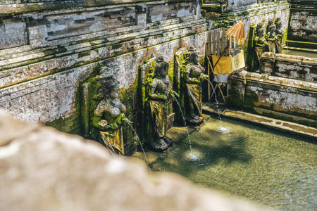 A high angle shot of the three statues at the bathing pool in Goa gajah Elephant Cave in Bali Indonesiaの写真素材